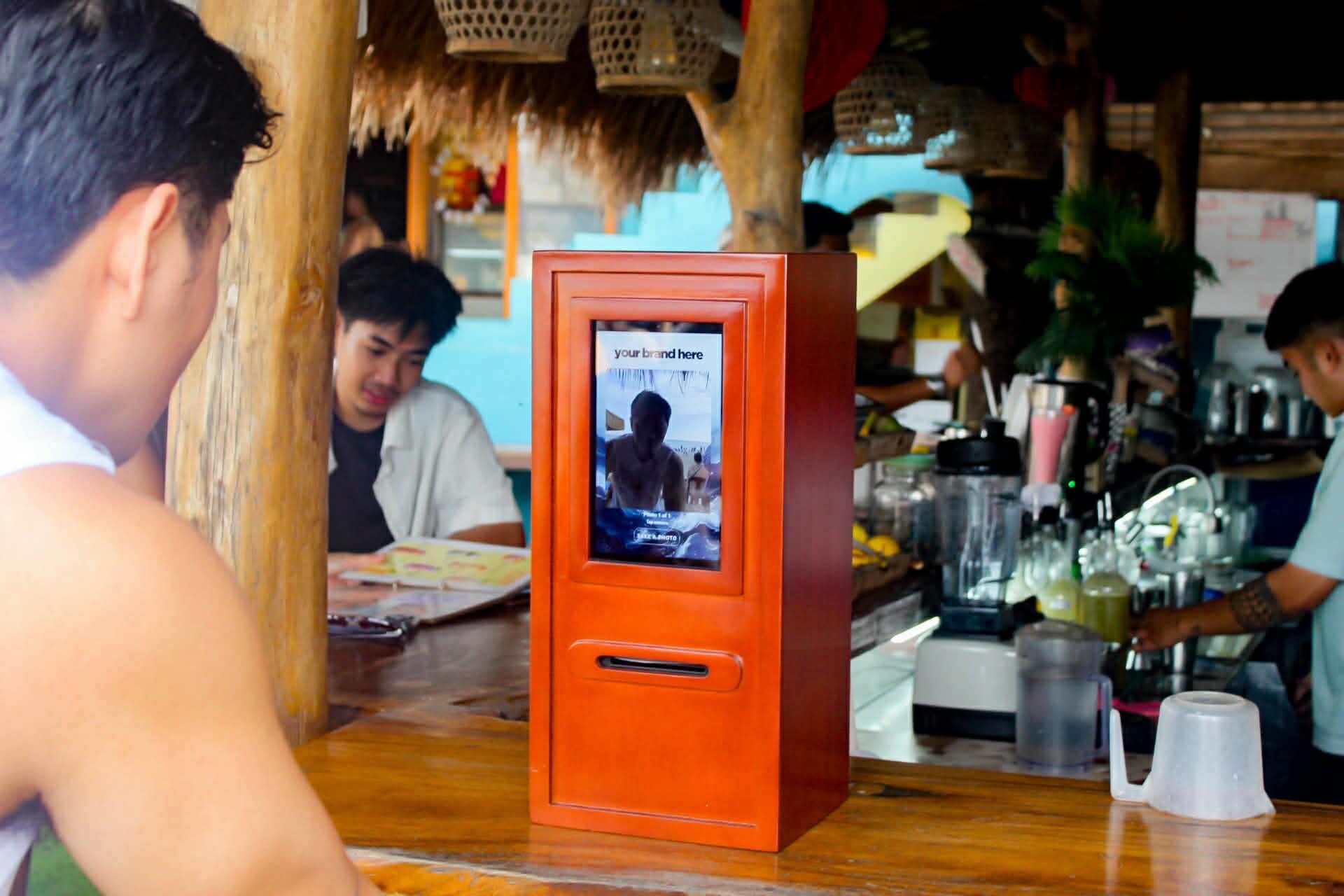Wooden Click2Keep booth at a beach bar