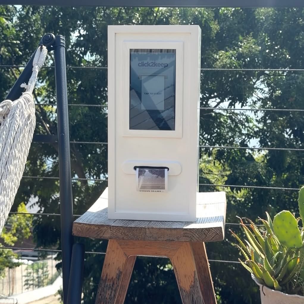 Click2Keep booth in a garden setting